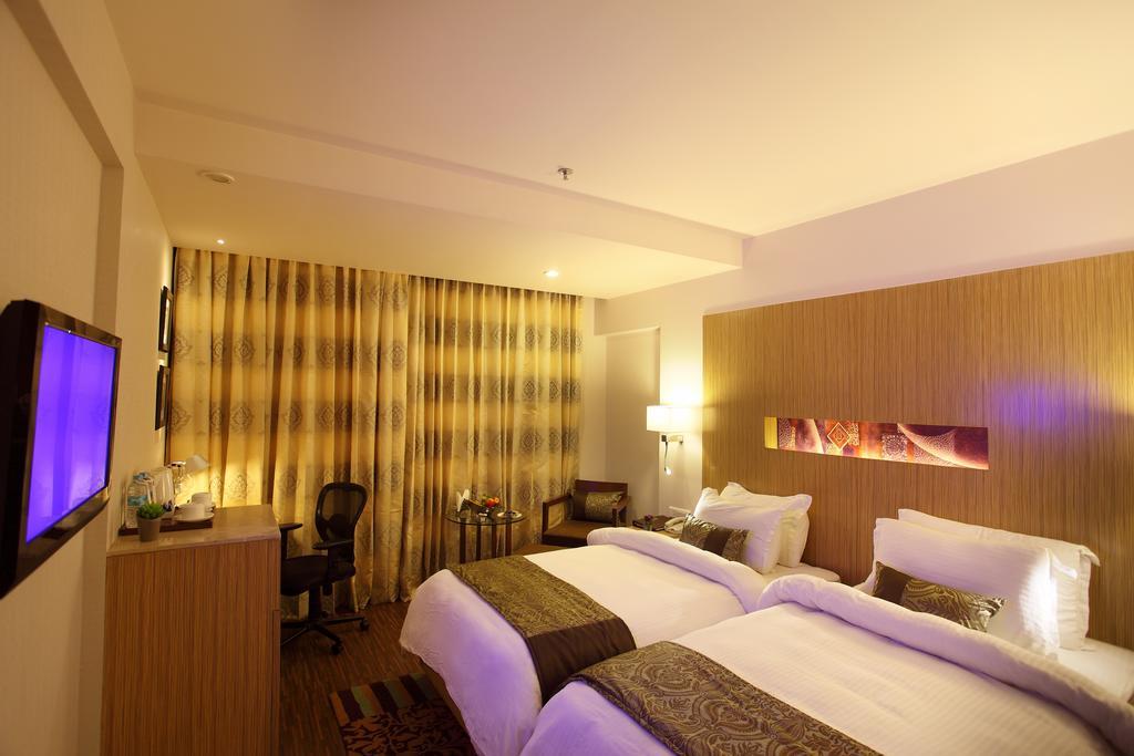 Comfort Inn Legacy Rajkot Habitación foto